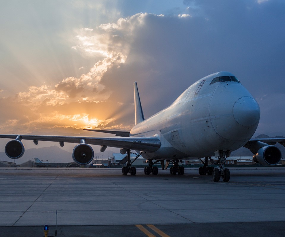 a large passenger jet sitting on top of a runway