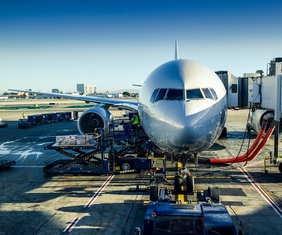 a large passenger jet sitting on top of a tarmac at an airport